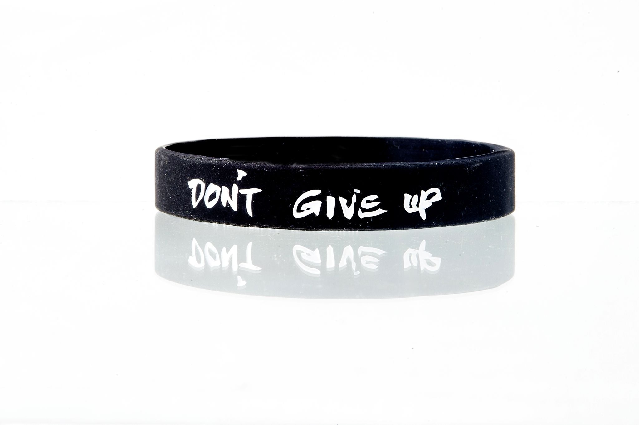 Don’t Give Up Connection Band by Spirit Linx — a 1/2‑inch wristband symbolizing perseverance, honesty with oneself, and the steady strength to keep moving forward.