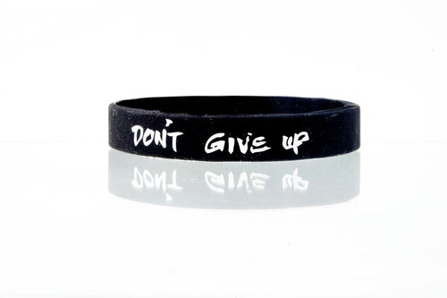 Don’t Give Up Connection Band by Spirit Linx — a 1/2‑inch wristband symbolizing perseverance, honesty with oneself, and the steady strength to keep moving forward.