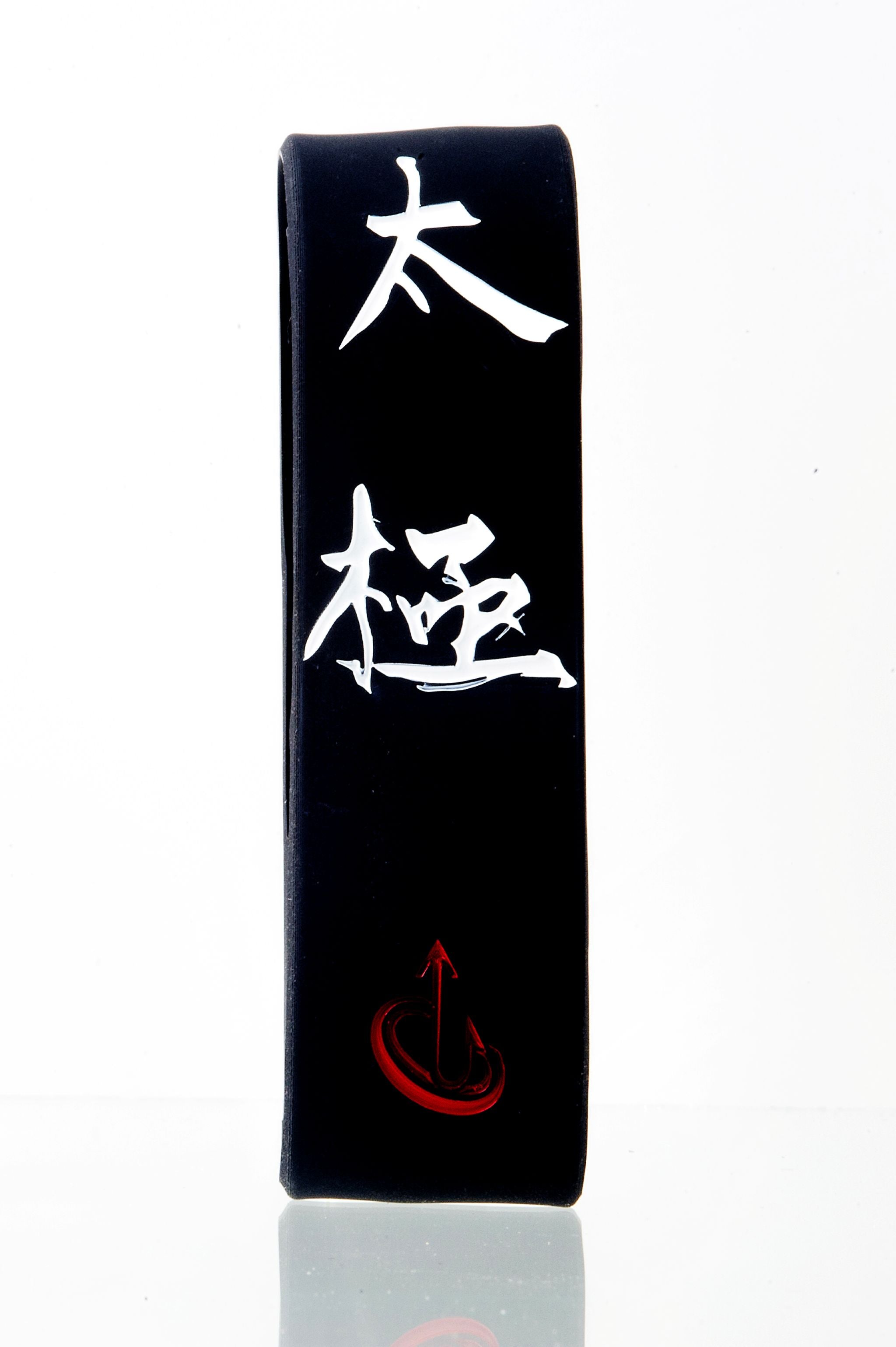 Tai Chi Intentional Band by Spirit Linx — a 1‑inch black wristband symbolizing flow, oneness, and the harmony between mind, body, and energy.
