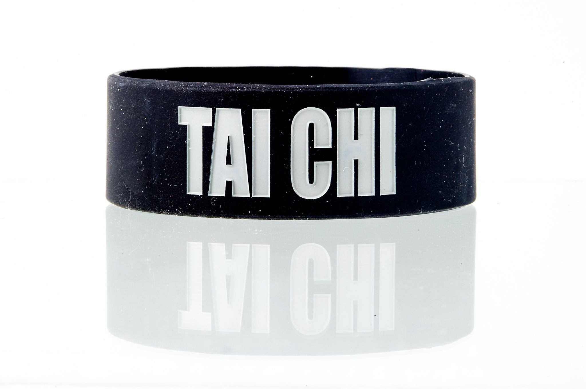 Tai Chi Intentional Band by Spirit Linx — a 1‑inch black wristband symbolizing flow, oneness, and the harmony between mind, body, and energy.